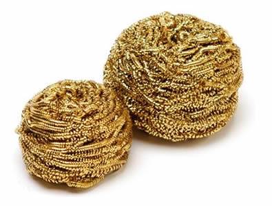 Two piece of brass scrubbers in winding structure and golden surface.